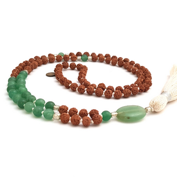 HandmadeProsperity Mala Necklace – Green Aventurine & Rudraksha for Abundance curled on the table